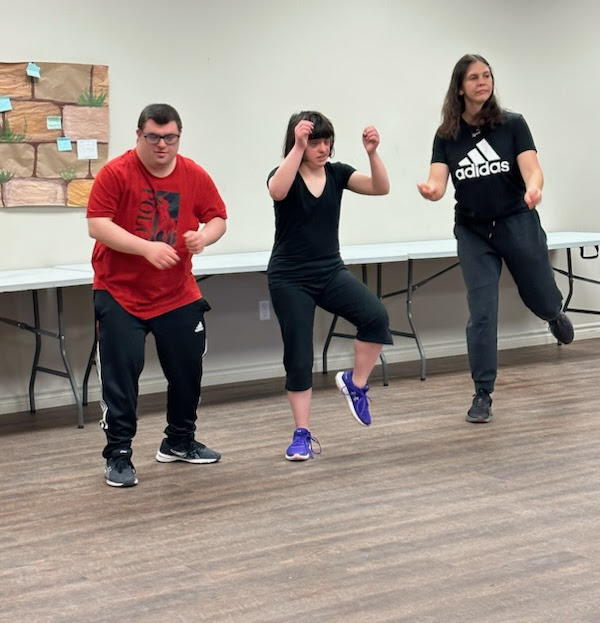 Rita, her dance partner and DANI staff Sydney, rehearsing a dance.